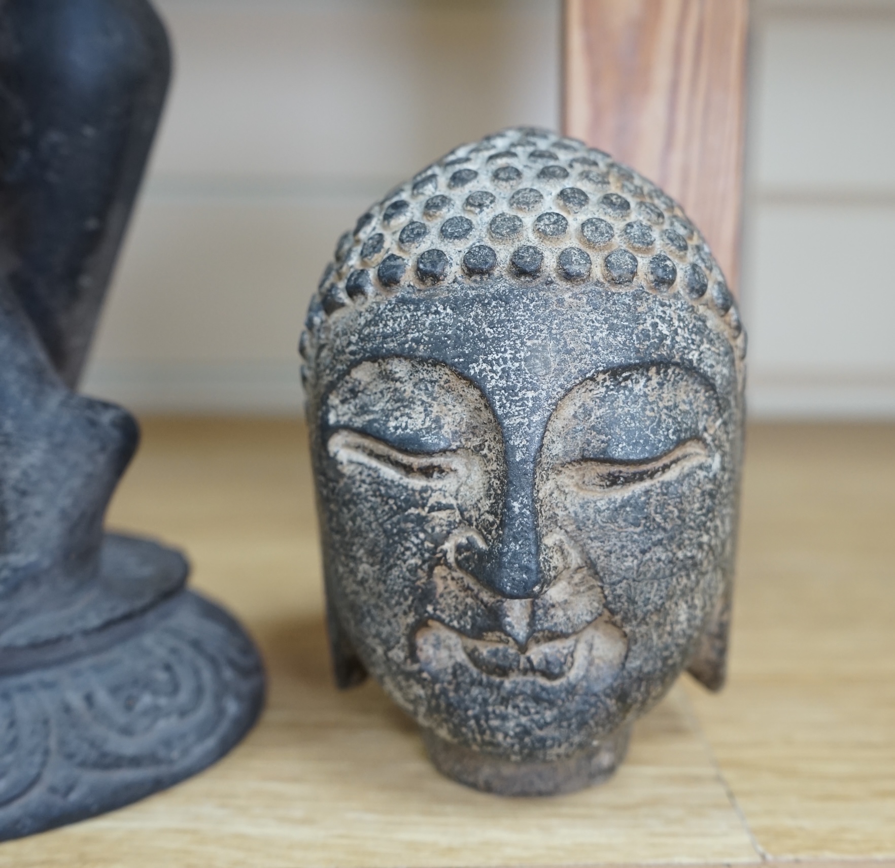 An Indian stone Buddha head and a figural carving, 29cm. Condition - figure repaired